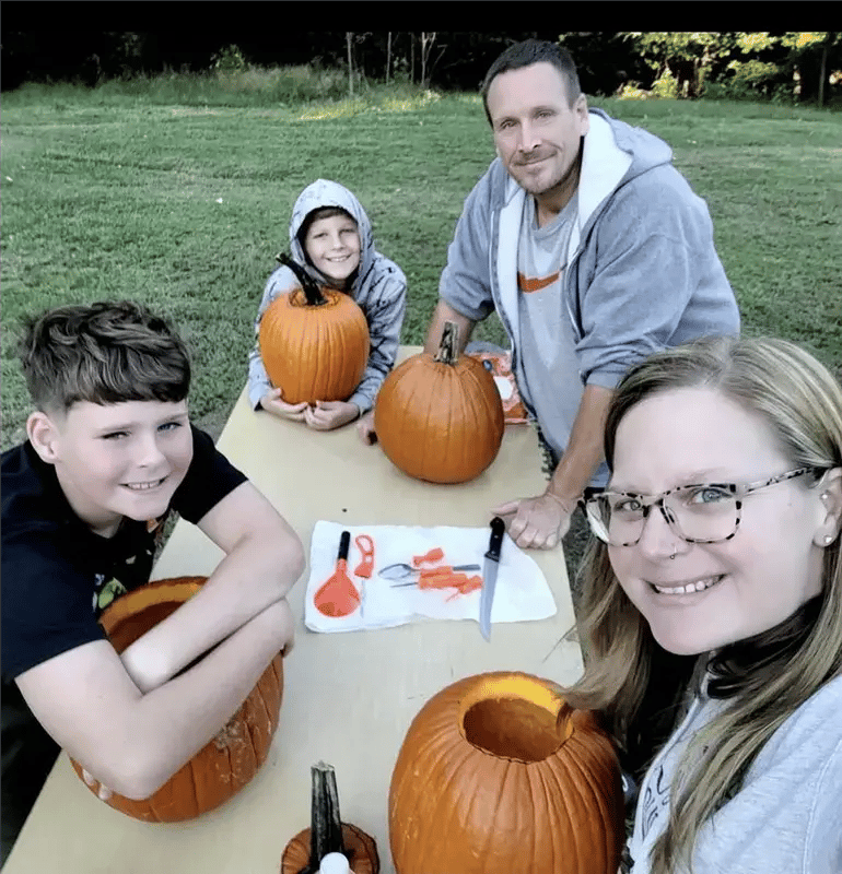 Image of family carving pumpkins as Avenues Recovery shares Kimberly's story