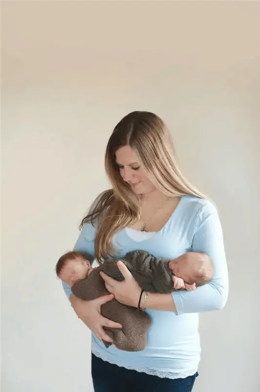 Image of woman holding twin baby boys as Avenues Recovery shares Kimberly's story