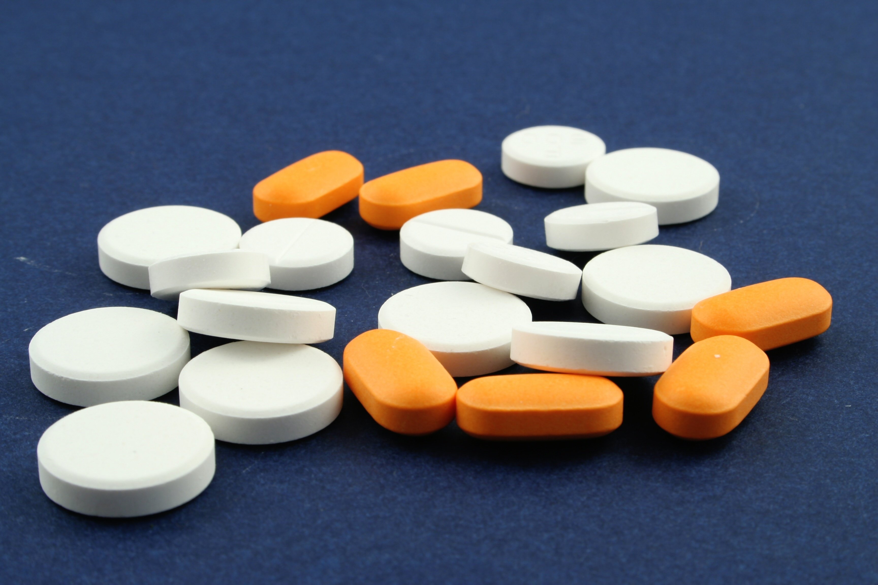 Image of white and orange pills as Avenues Recovery explains how long does valium stay in your system