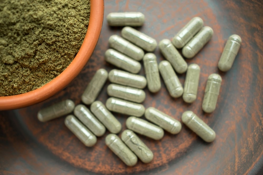 Image of green Kratom pills as Avenues Recovery explores Kratom addiction treatment