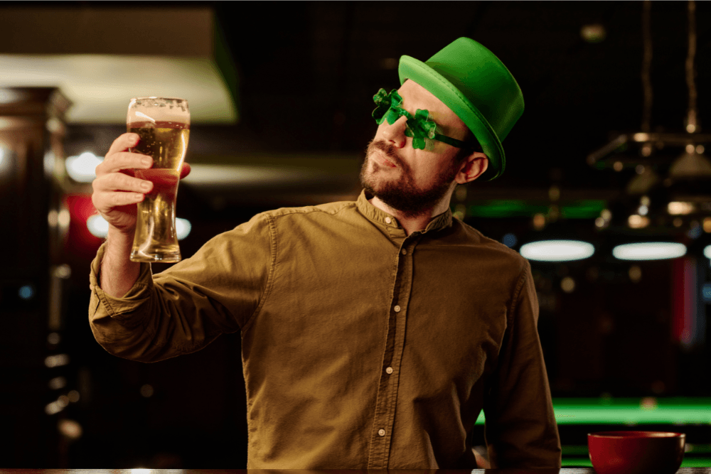 Man looking at beer, unsure whether he has a habit or an addiction.