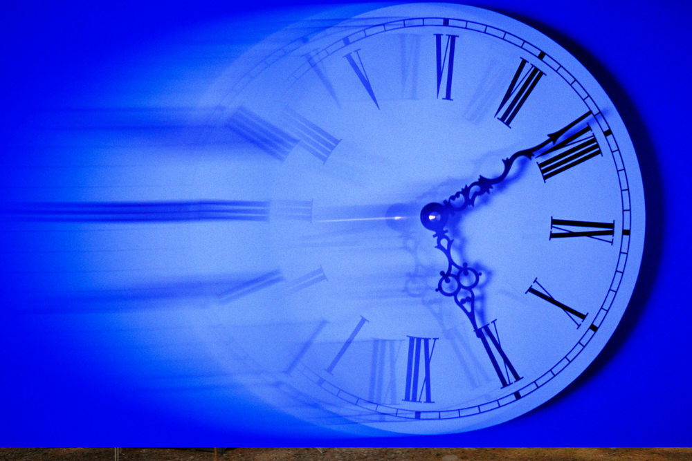 Blurry clock symbolizing hydroxyzine release timing and duration in the body.