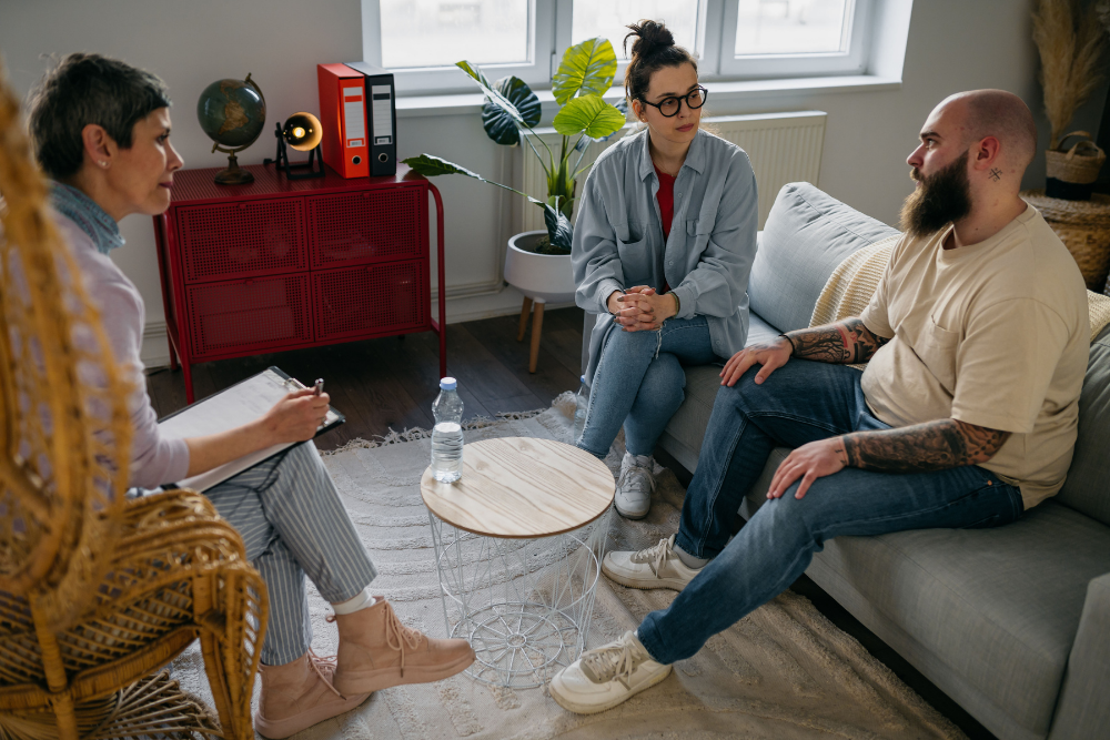 Couple working on healthy communication and conflict resolution in therapy in couples rehab