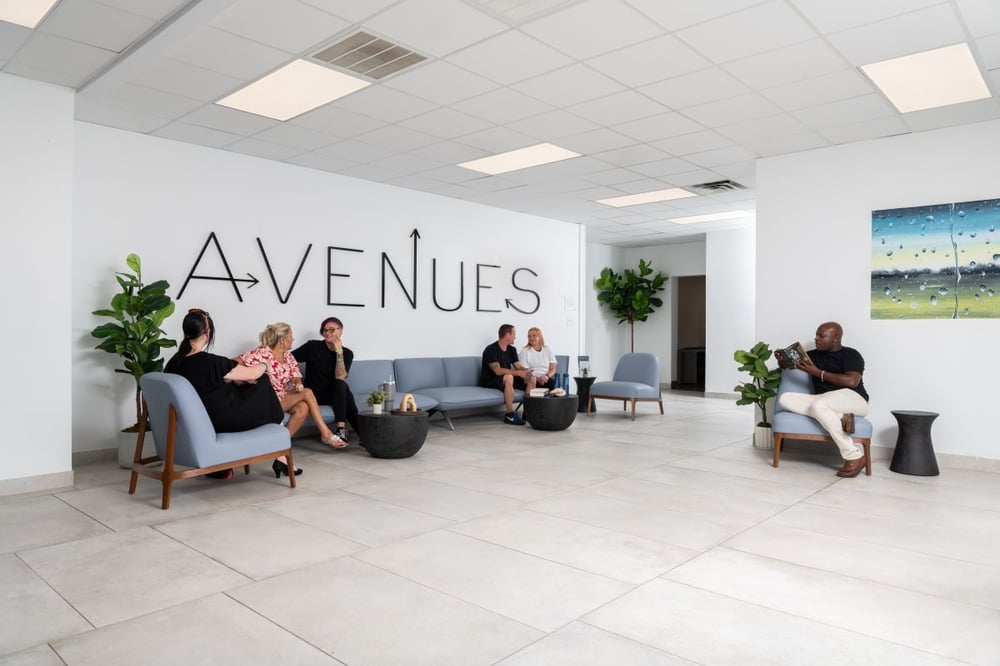 Image of people talking in supportive setting as Avenues Recovery explores what is sherm drug