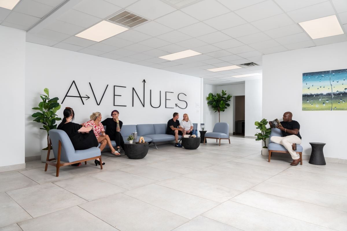 Image of people talking in supportive setting as Avenues Recovery explores what is sherm drug