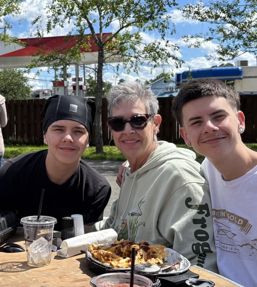 Image of older woman with young boys as Avenues Recovery shares Kathi's story