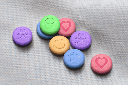 Illustration of ecstasy pills, one of the most addictive substances, which can cause long-term health risks