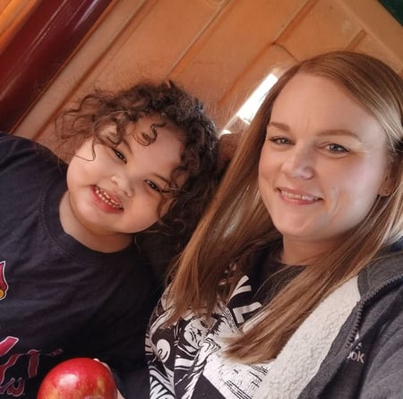 Image of smiling woman with little girl as Avenues Recovery shares Kristine's story