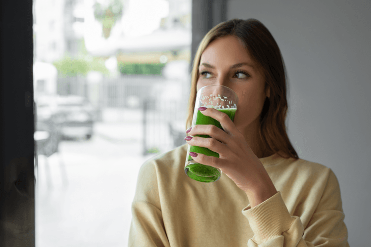 Girl_drinking_green_drink_75