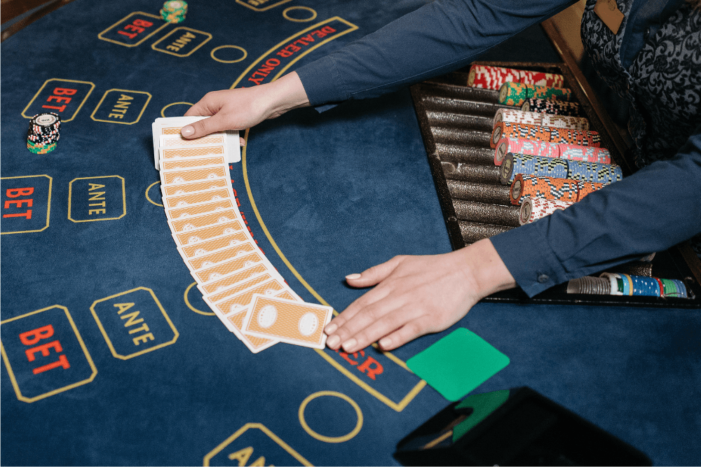 Person sitting at a gambling table, illustrating how habits can become addictions.