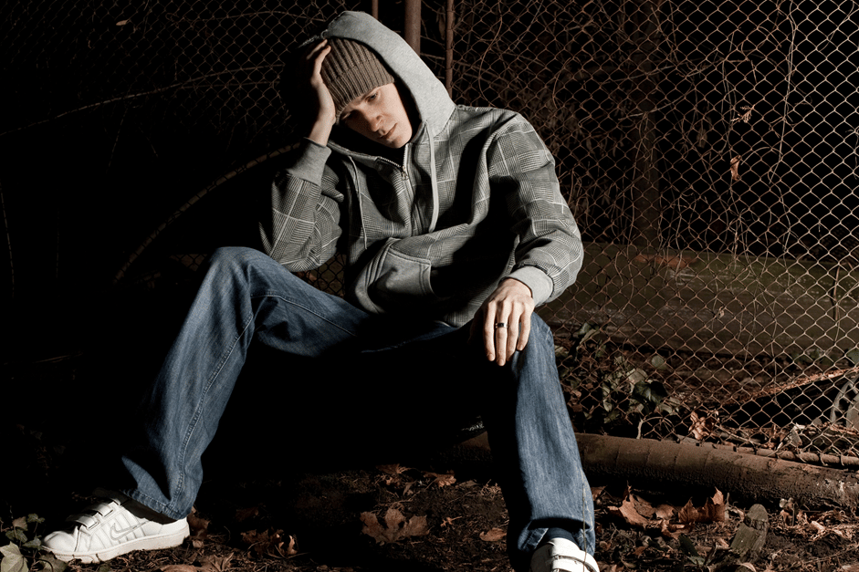 Man sitting outside. Homelessness, addiction, and mental health problems are often found together.