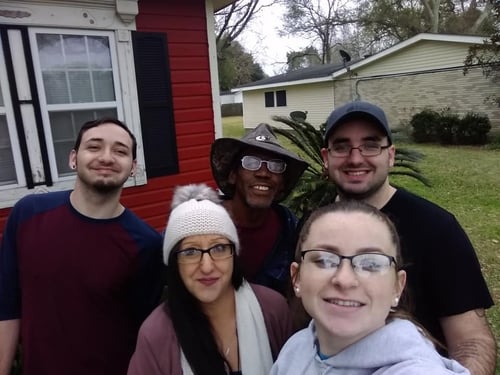 Image of people smiling outdoors as Avenues Recovery shares Derrick's story