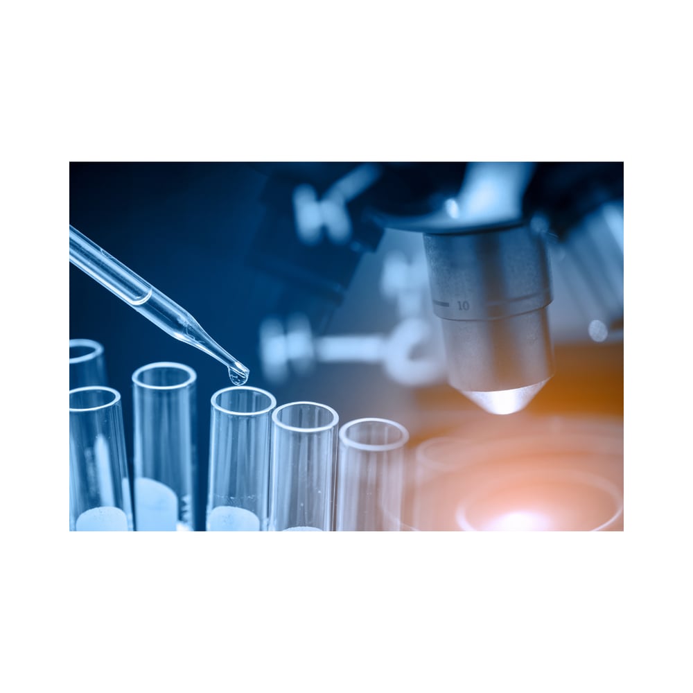 Club drugs being transferred from a syringe into a test tube, perhaps in a secret lab.