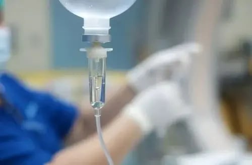 Illustration of ketamine in an IV, a medication on the list of the most addictive substances