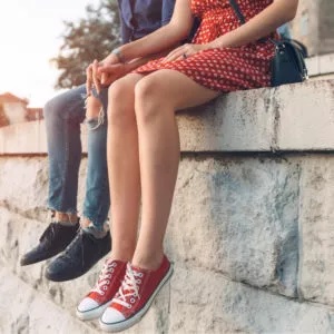 Legs-Dangling-On-A-Wall