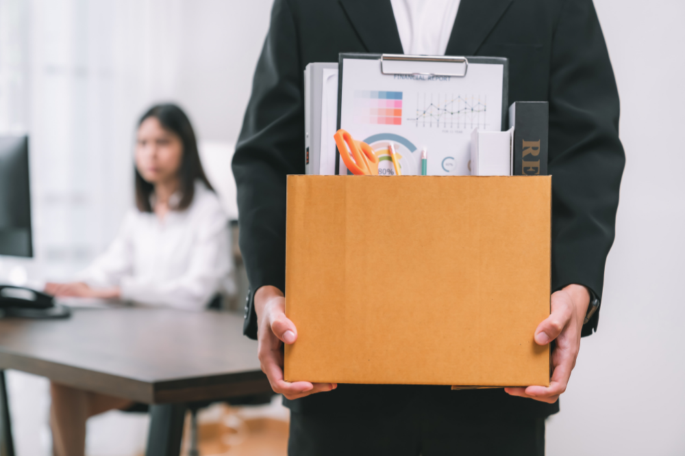 Individual leaving work with personal items, beginning his journey to rehab