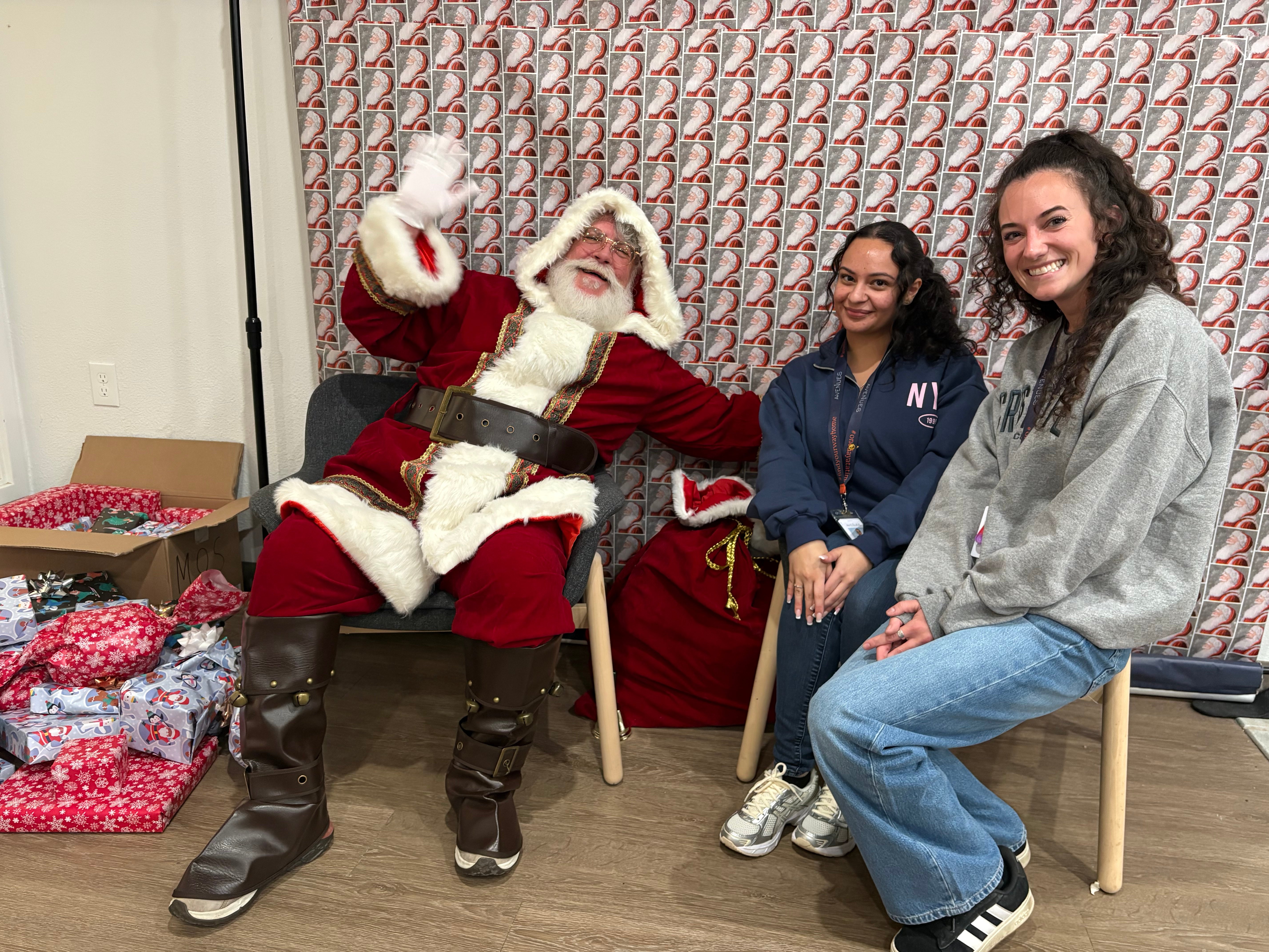 Image of kids with Santa as Avenues Recovery shares about Secret Santa gift exchange