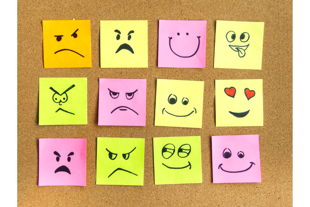 Faces on sticky notes depicting different emotions. Mixed feelings when visiting someone in rehab are normal.