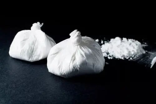 Illustration of bags of cocaine, highlighting the high risk of the most addictive substances