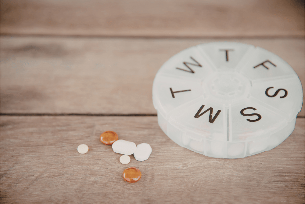 Weekly pill organizer with medicines. Doses of gabapentin and Xanax must be carefully spaced.
