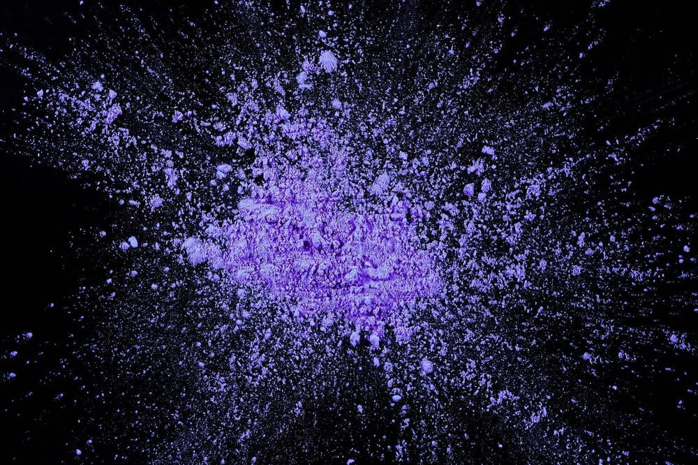 Purple powder spread across a surface, illustrating the dangers surrounding purple heroin and synthetic opioid mixtures.