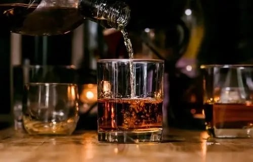 Illustration of alcohol, one of the most addictive substances, showing an alcoholic beverage in a glass