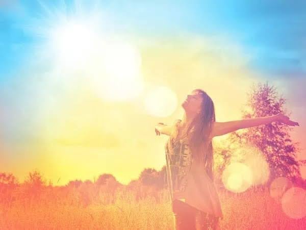 Woman in recovery stands free in field. This list of recovery words helps you navigate sobriety.