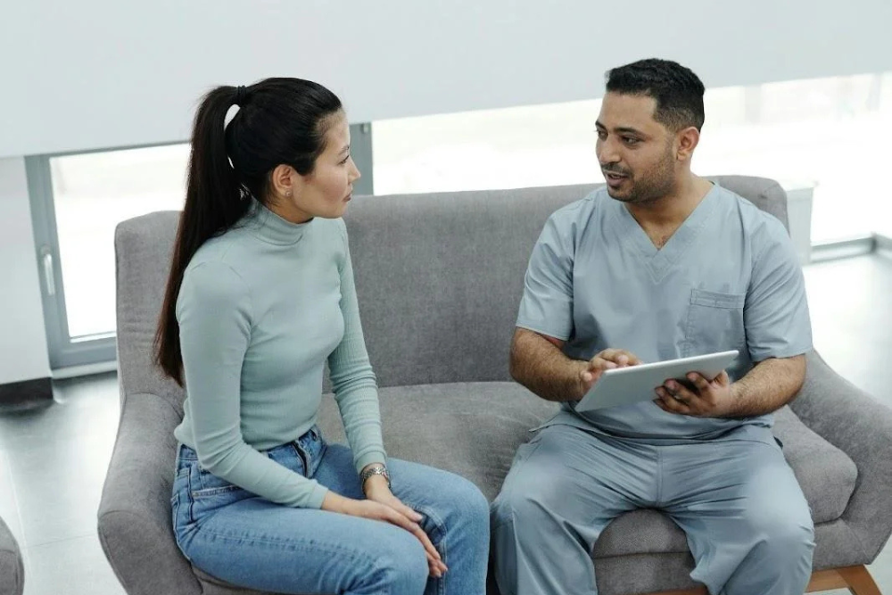 Patient discussing ambulatory detox options with a healthcare professional in a clinical setting