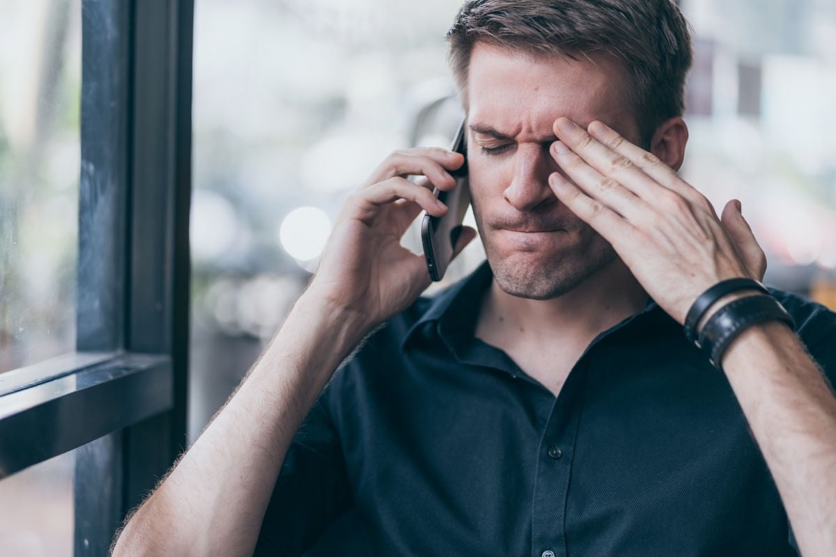 Image of stresses man on phone as Avenues Recovery explores stress addiction