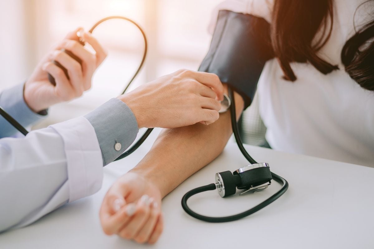 Image of doctor taking blood pressure as Avenues Recovery explores Adderall effects on the heart