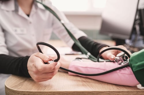 Image of nurse taking blood pressure as Avenues Recovery shares signs of codeine overdose