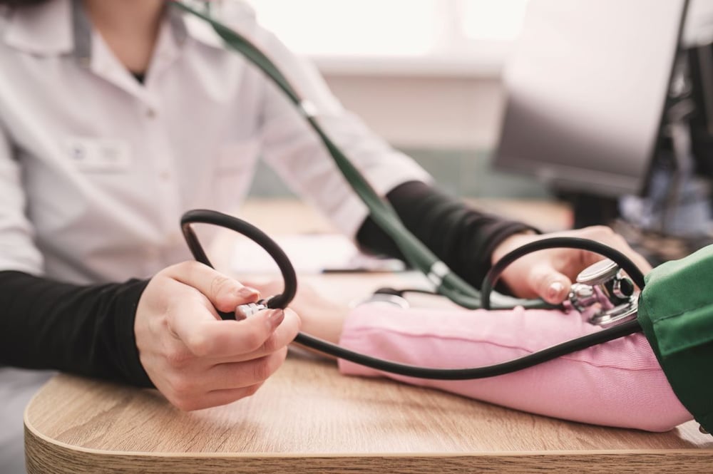 Image of nurse taking blood pressure as Avenues Recovery shares signs of codeine overdose