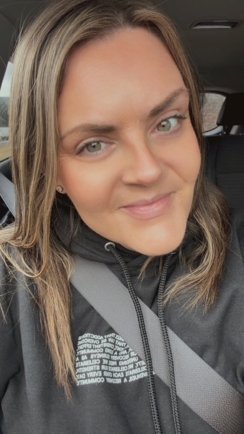 Image of smiling woman in car as Avenues Recovery shares Colleen's story