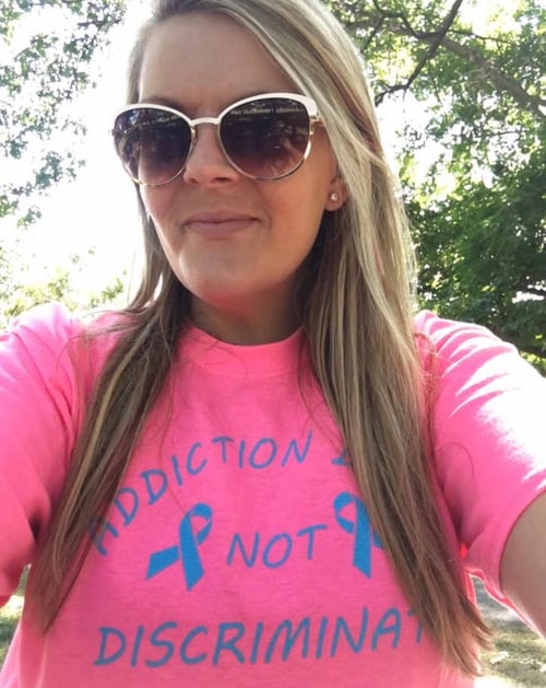 Image of smiling woman in sunglasses and pink tshirt as Avenues Recovery shares Colleen's story