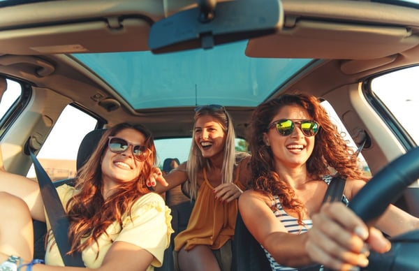 Image of laughing women in car as Avenues Recovery explores sober bars and mocktails near me in Louisiana