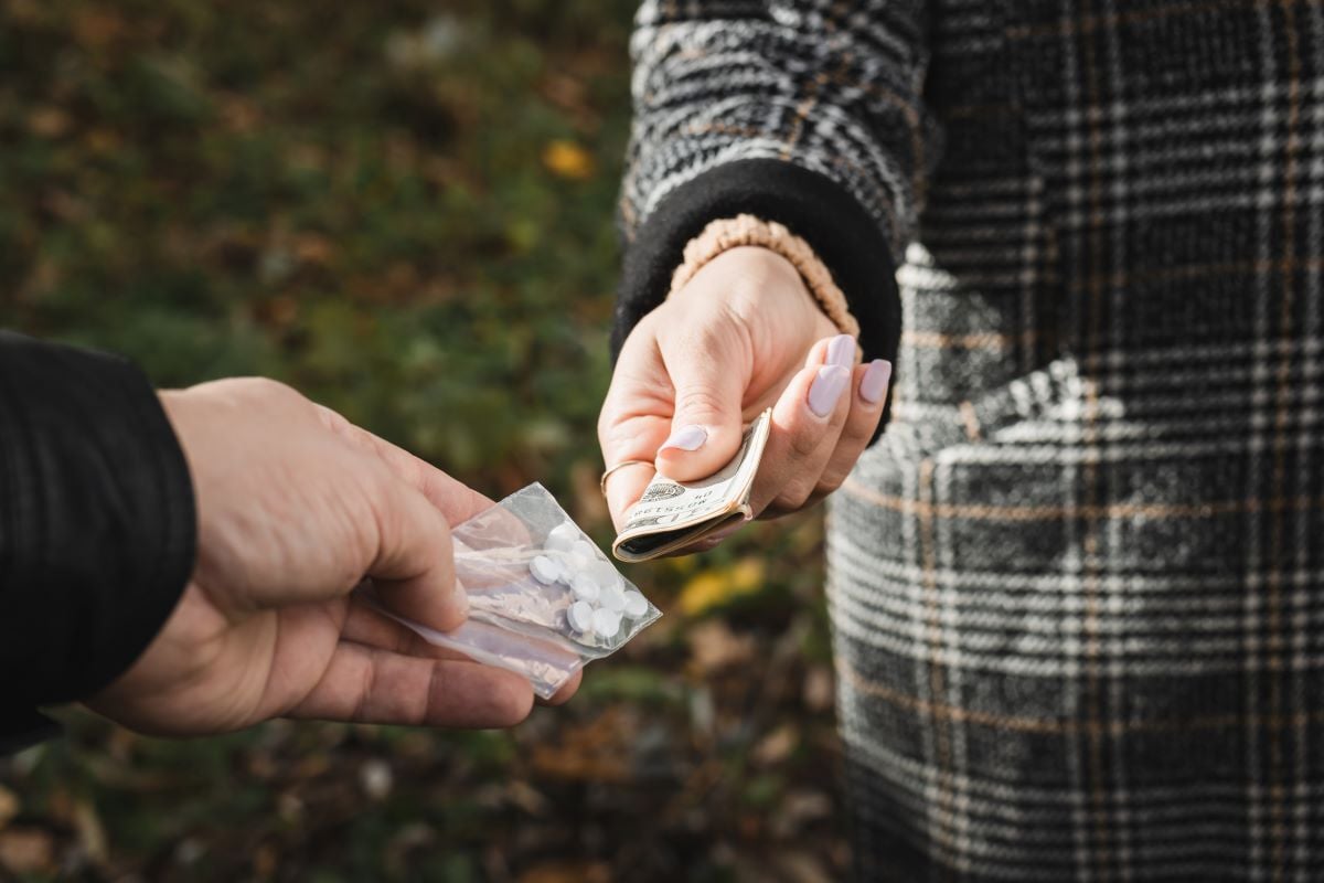 Image of drug exchange as Avenues Recovery explores designer drugs