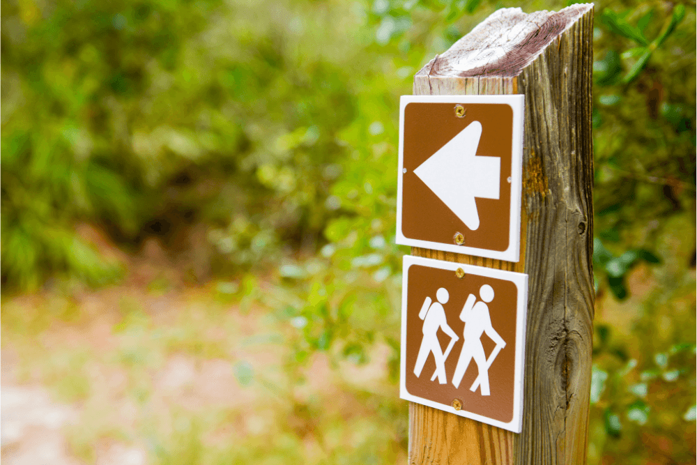 Hiking sign outdoors. Outdoor and adventure therapy can be incorporated in non-12-step recovery programs.