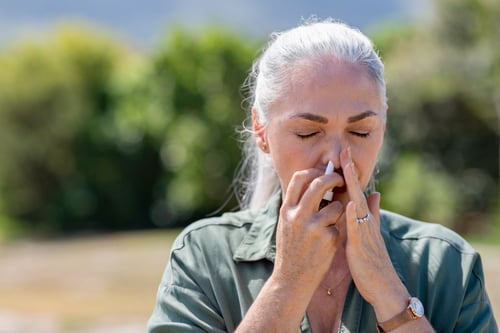 lady using nasal spray