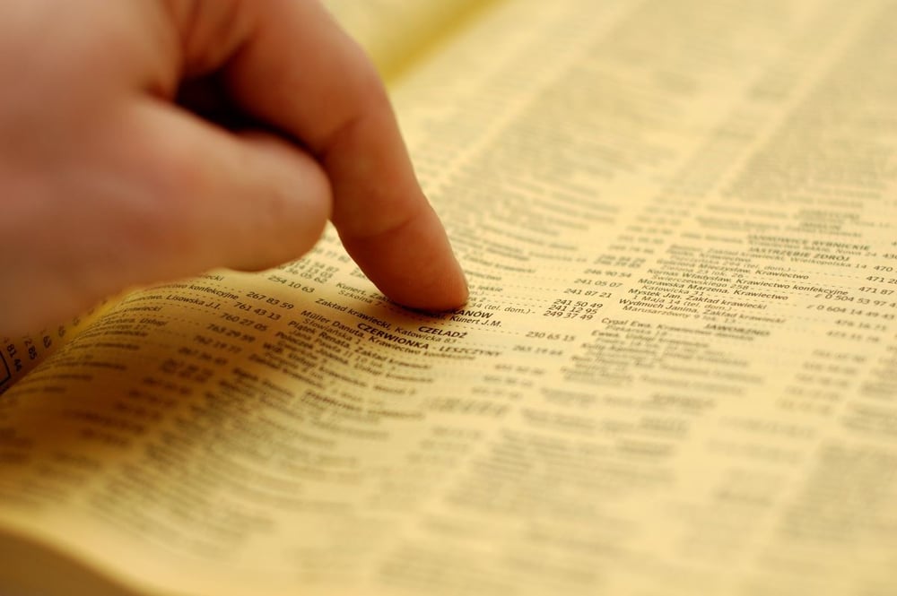 Image of finger running down dictionary as Avenues Recovery explores "is codeine addictive"?