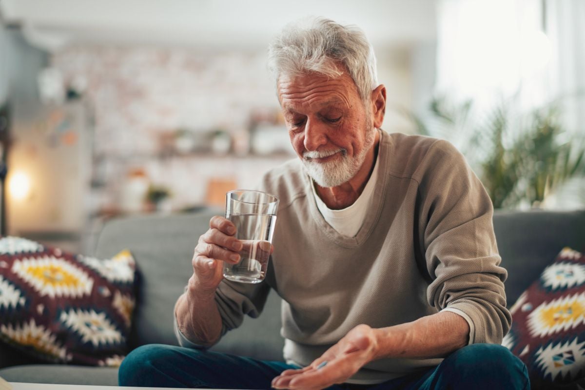 Image of old man taking pill as Avenues Recovery explores depression and addiction