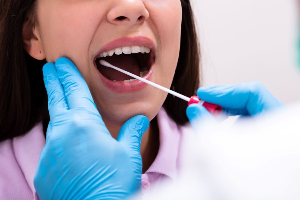 Image of saliva test being administered as Avenues Recovery explains how long does Valium stay in your system
