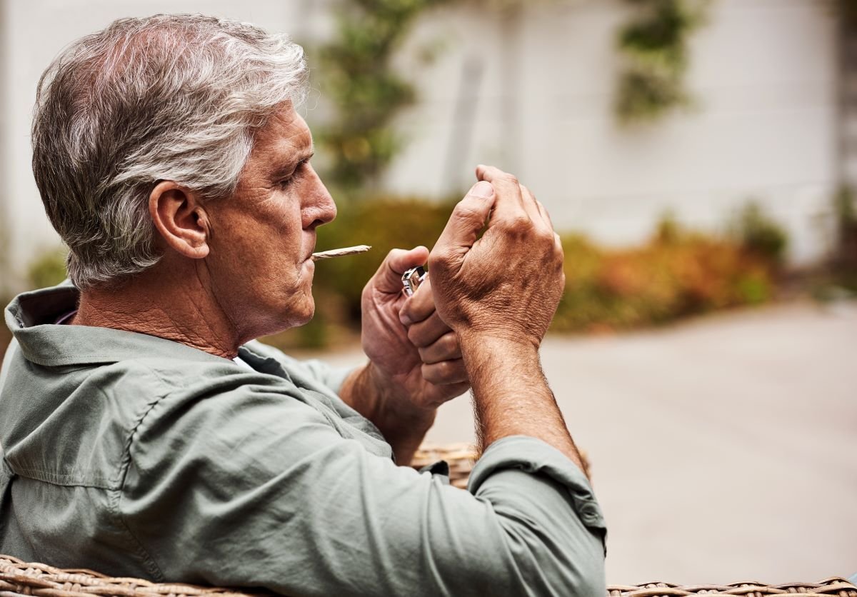 Image of old man smoking weed as Avenues Recovery explores "Does marijuana or weed cause dementia?"