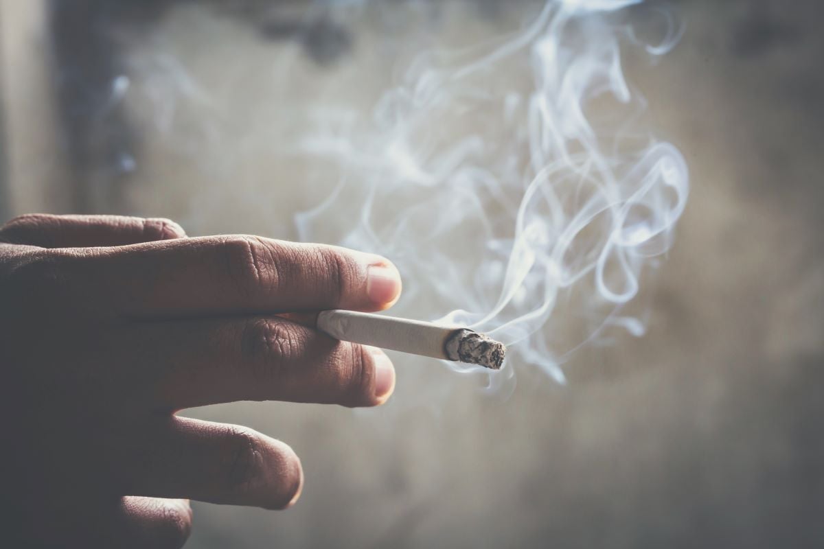 Image of smoke curling from cigarette as Avenues Recovery explores "Does smoking weed cause lung cancer?"