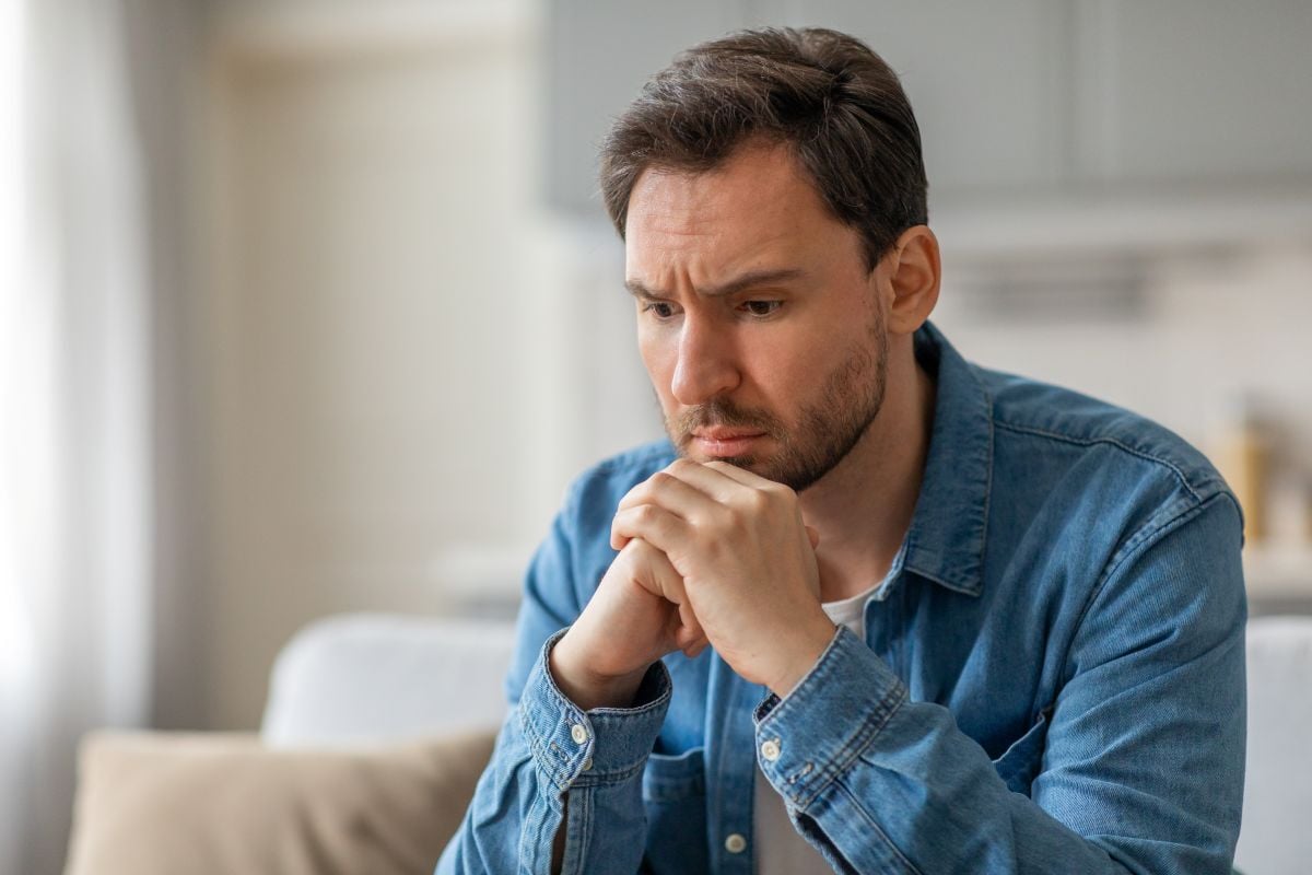 Image of man thinking as Avenues Recovery explores grief and addiction