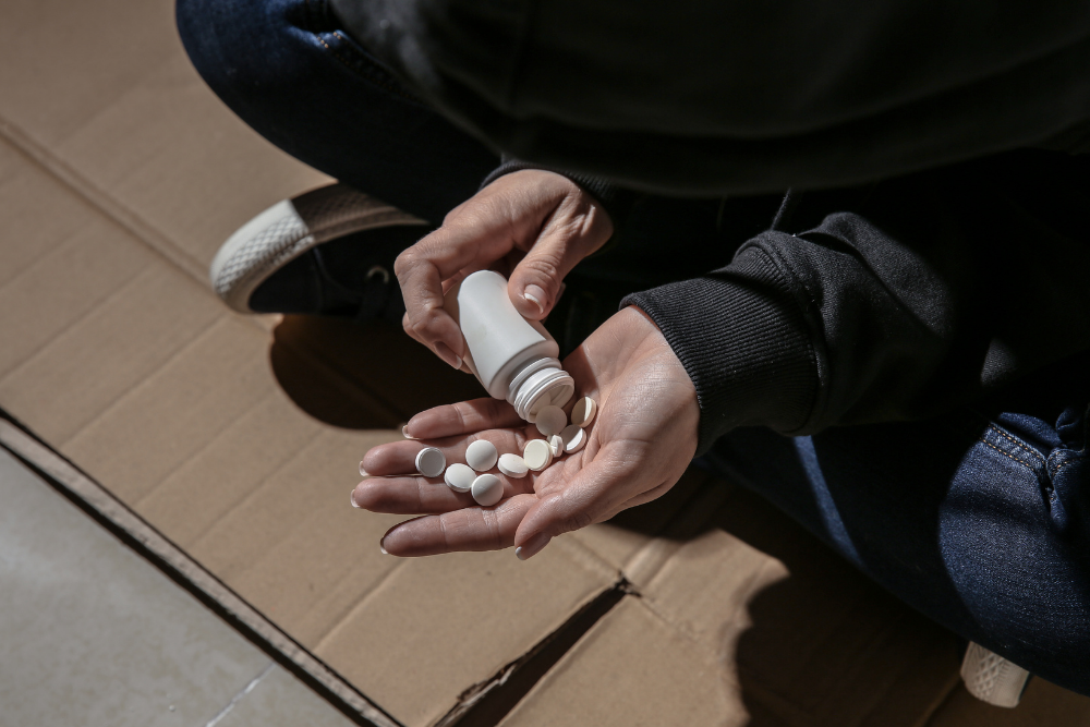 Person pouring pills into their hand questioning how long the Flexeril’s effects will last.