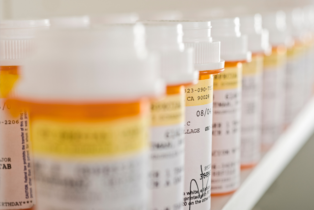 Multiple Flexeril bottles arranged in a row, symbolizing risks of overdose from taking too much medication