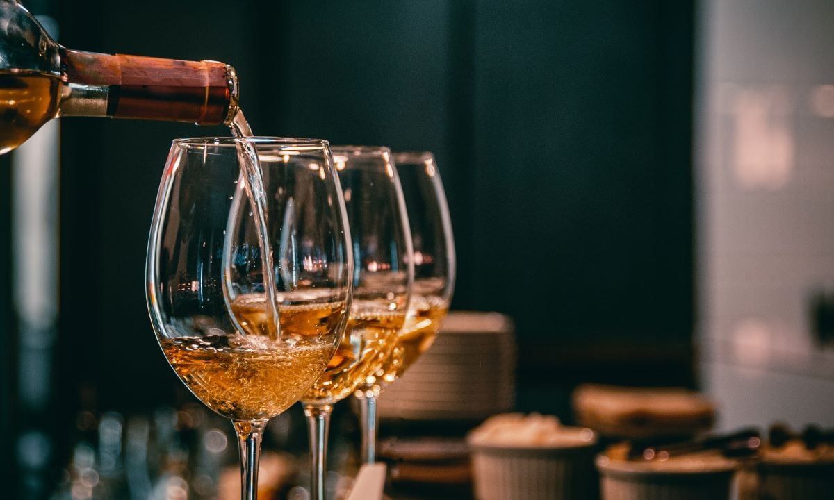Image of wine being poured into glasses as Avenues Recovery explores medication for alcoholism